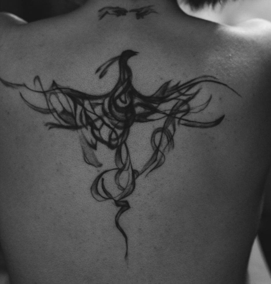 Fire Phoenix tattoo at the back